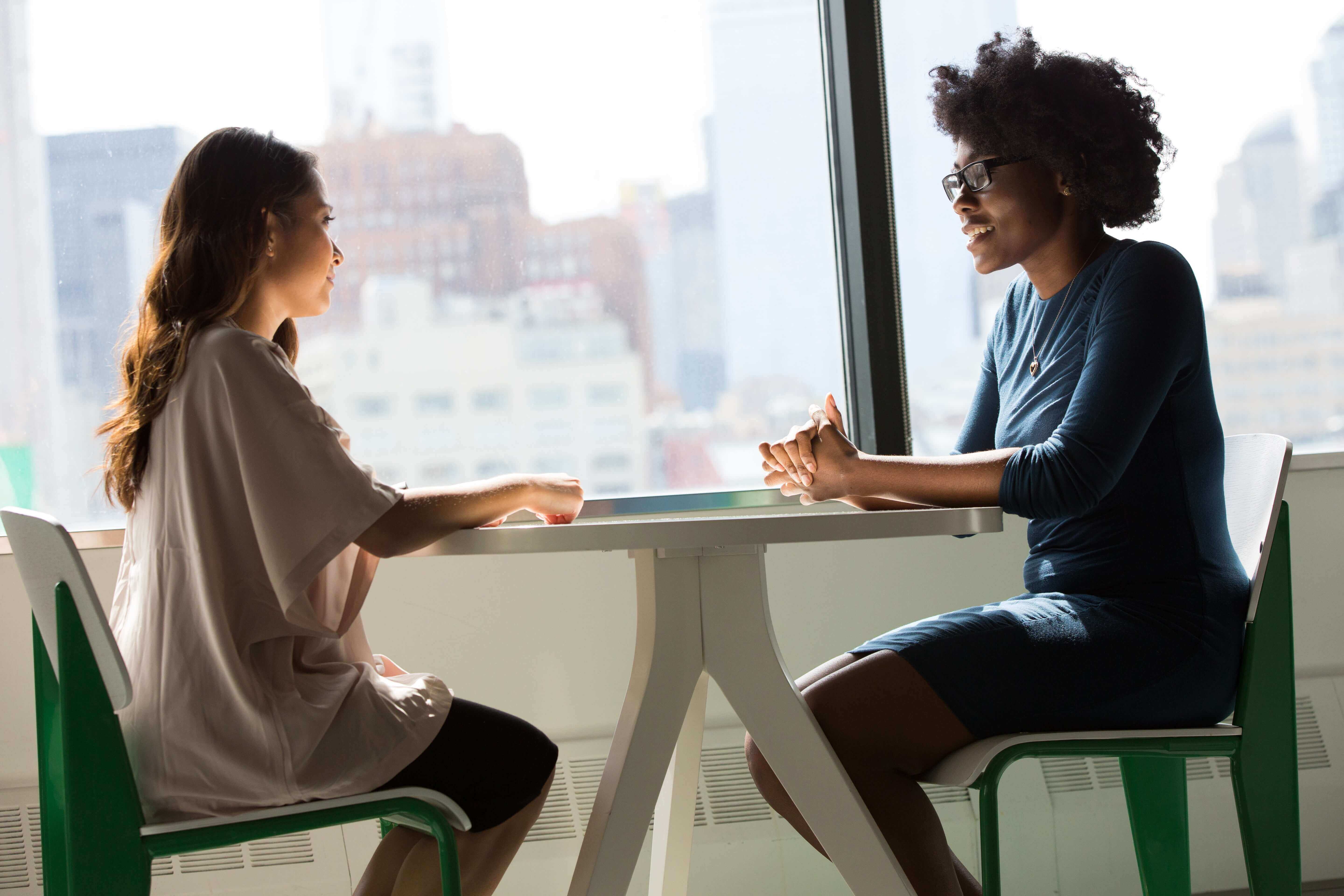 Are you transitioning to a UX career? Here’s how to reframe your previous work experience and use it to your advantage 2 two women having a conversation