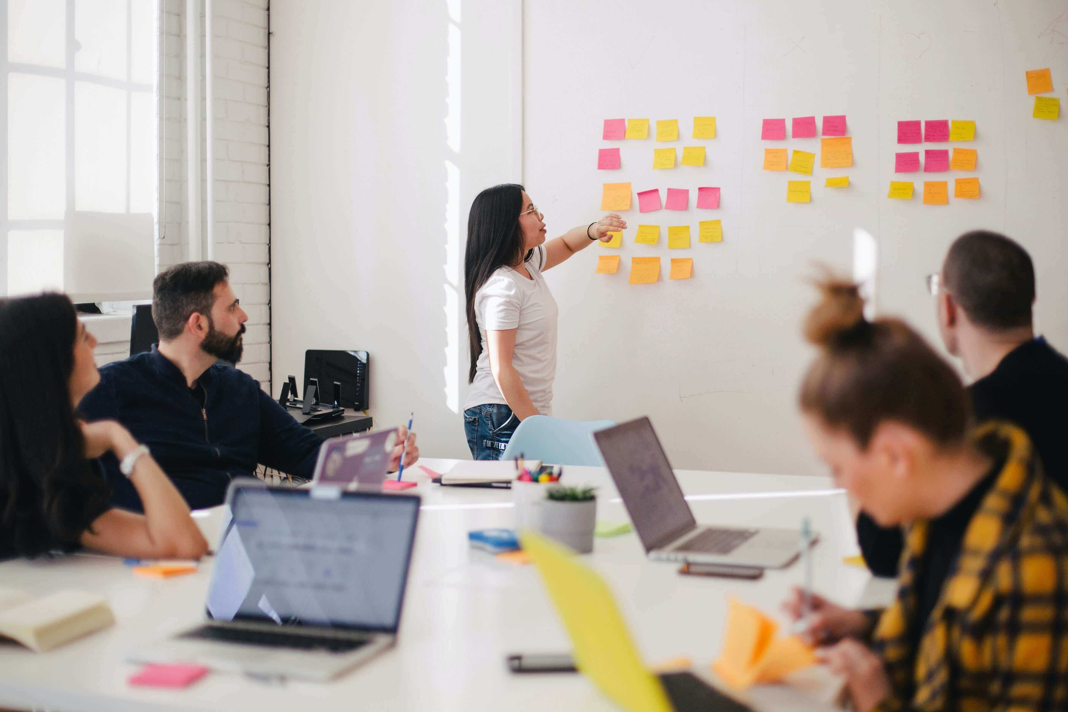 Are you transitioning to a UX career? Here’s how to reframe your previous work experience and use it to your advantage 3 group collaborating on a project