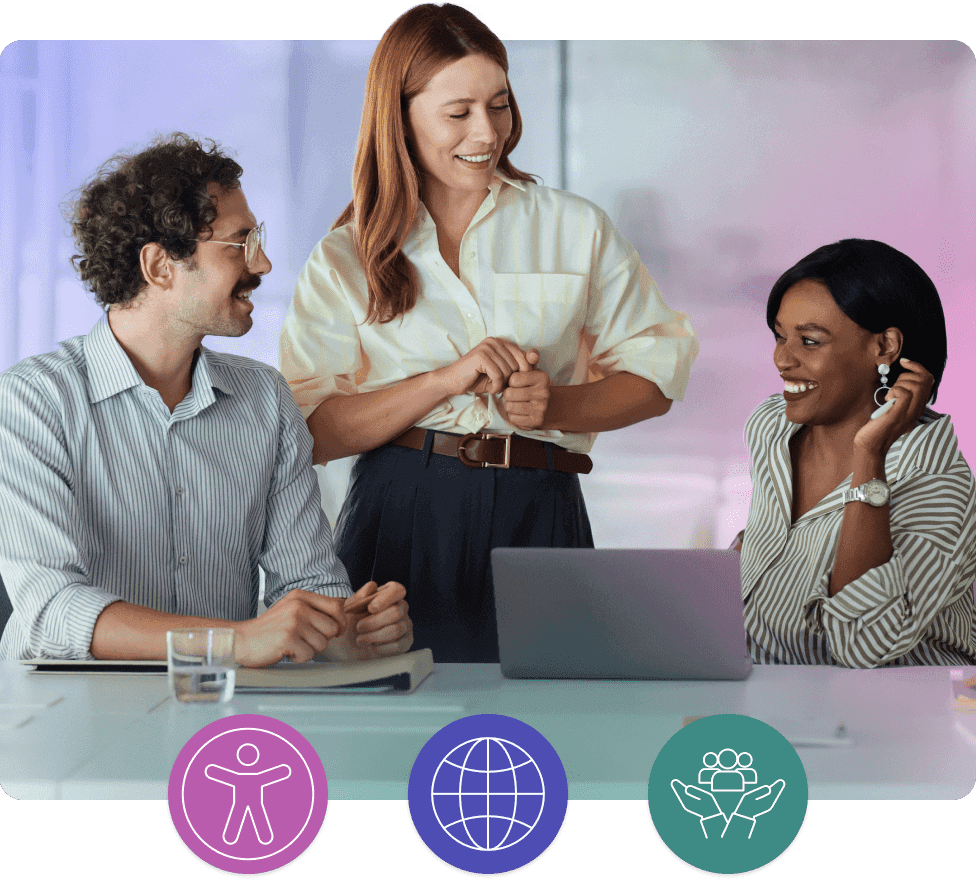 Team members discussing work around a laptop.